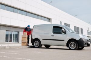 Man loading goods in Delivery Vehicle