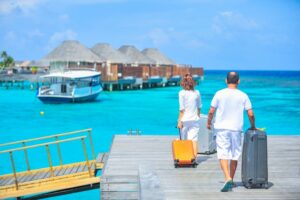 Couple with their trolley bag at vacation