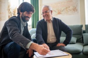 Two people smiling after getting unsecured Business Loan