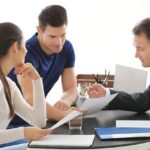 Group of three people discusing on Public adjusting