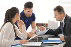 Group of three people discusing on Public adjusting